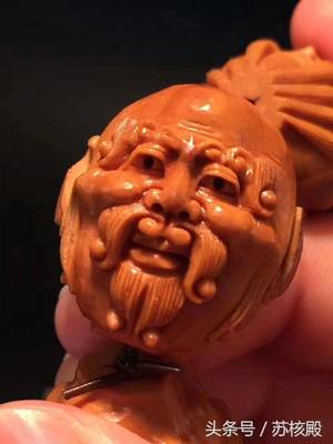方寸之间显神韵 如何挑选一枚上乘的核雕十八罗汉头